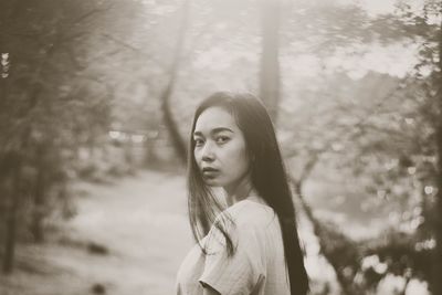 Portrait of woman in forest