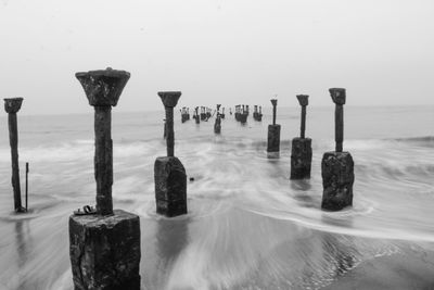 Close-up of ice on sea against sky