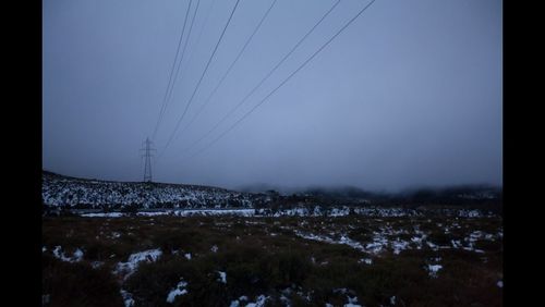 Scenic view of snow covered mountains