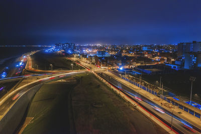 High angle view of light trails on road at night