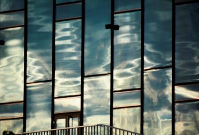 Low angle view of sky seen through glass window