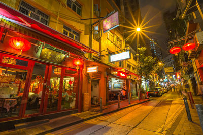 Illuminated city street at night