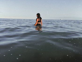 Full length of man in sea against sky