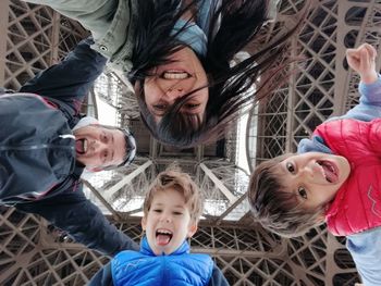 High angle portrait of happy siblings outdoors