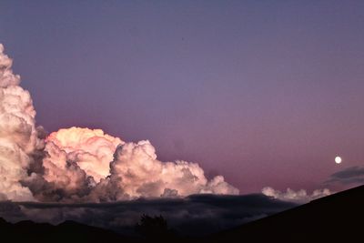 Low angle view of silhouette land against sky at sunset
