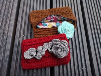 High angle view of woolen pouch on wooden table