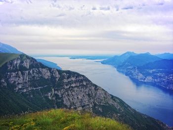 Scenic view of lake and mountains against sky