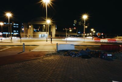 Illuminated city street at night