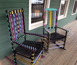 Colorful rocking chairs on porch