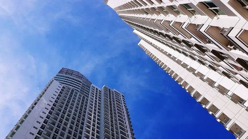 Low angle view of modern buildings against sky