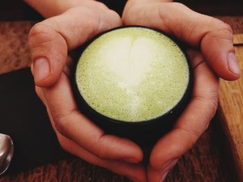 Close-up of person holding lemon