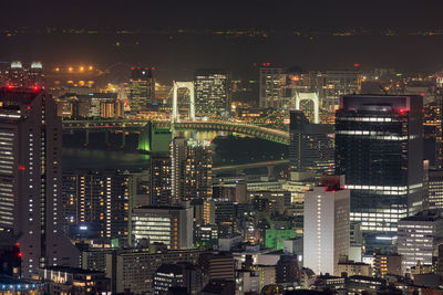 Illuminated buildings in city at night