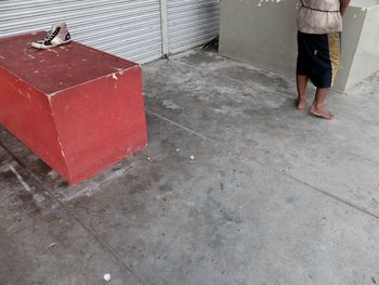 Low section of man standing on floor