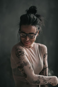 Portrait of young woman wearing eyeglasses