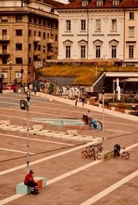 High angle view of people walking on road