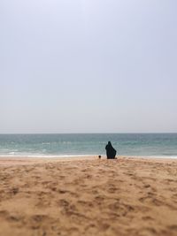 Scenic view of beach against clear sky