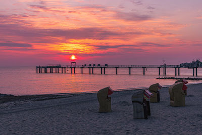 Scenic view of sea against romantic sky at sunset