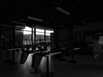 Empty chairs and tables in restaurant