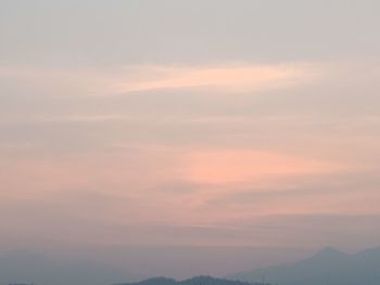 Scenic view of mountains against sky at sunset