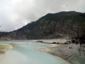 Scenic view of mountain against cloudy sky