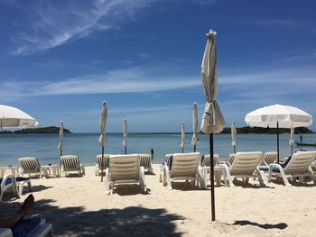 Canopies with sun loungers on beach