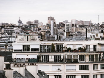 High angle view of buildings in city against sky