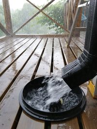 High angle view of hand on wet table