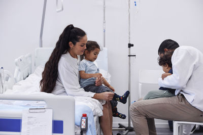 Parents with children in hospital room