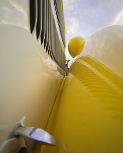 Close-up of airplane against sky