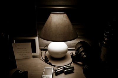 High angle view of illuminated electric lamp on table