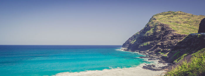 Scenic view of sea against clear blue sky