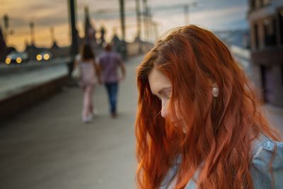 Close-up of woman standing on street in city