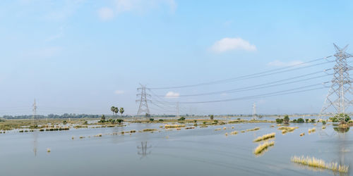 Electricity pylon against sky