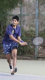 Full length of man playing with ball