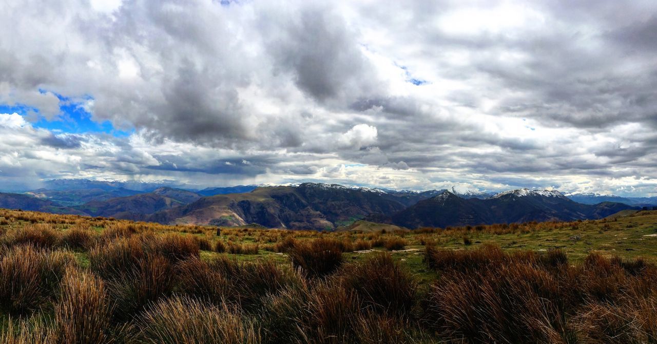 mountain, sky, landscape, tranquil scene, scenics, tranquility, mountain range, cloud - sky, beauty in nature, cloudy, cloud, nature, grass, non-urban scene, field, idyllic, remote, countryside, day, horizon over land