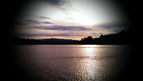Scenic view of lake at sunset