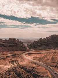 Scenic view of landscape against cloudy sky