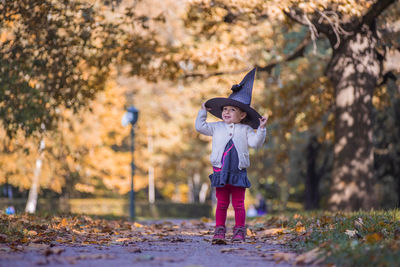 Full length of girl standing on land