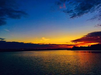 Scenic view of lake against romantic sky at sunset