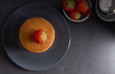 High angle view of fruits in plate on table