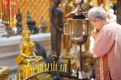 Statue of buddha against temple