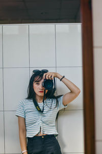 Full length of woman photographing