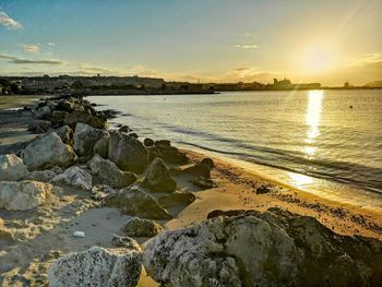 Scenic view of sea against sky during sunset