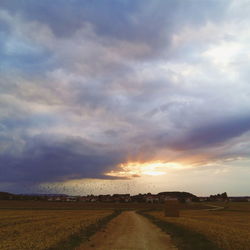 View of landscape against cloudy sky