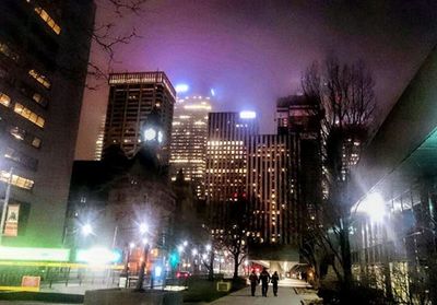 Modern buildings in city at night