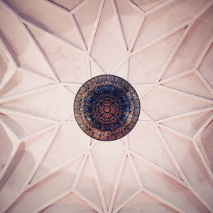 Low angle view of chandelier on ceiling in building