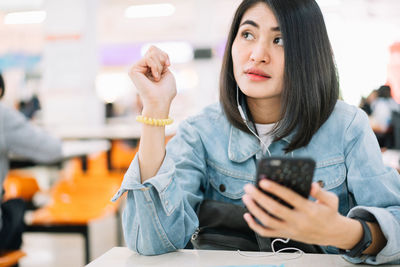 Young woman using mobile phone