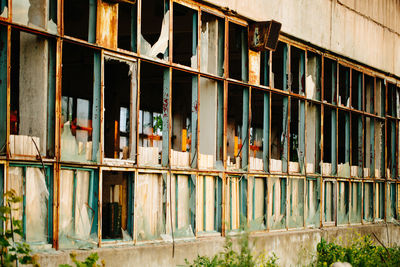 Abandoned building seen through broken window