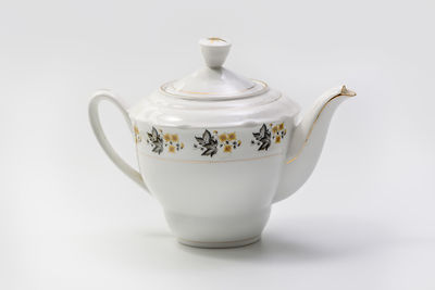 Close-up of tea cup against white background