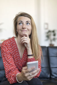 Young woman using mobile phone